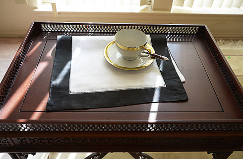 Place Mat. Black colored trimming.